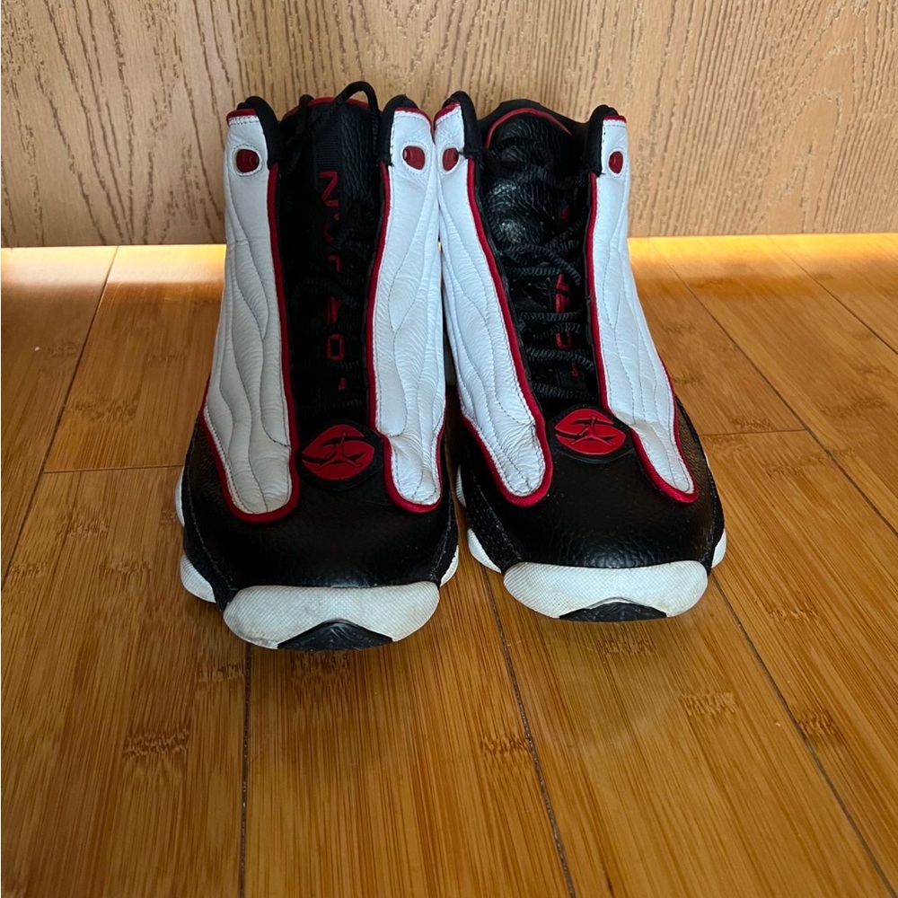 Black and White High-Top Sneakers with Red Accents